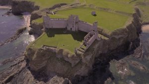 Aerial views of Seacliff beach and Tantallon Castle, North Berwick, Scotland.